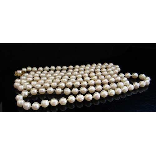 5037 - A single strand cultured pearl necklace with gold clasp stamped JKa 9ct, 100cm long