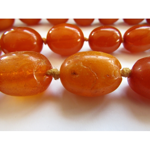 5047 - Two amber bead necklaces, 68cm and 72cm long, 148g
