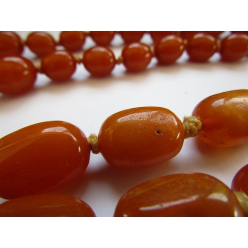 5047 - Two amber bead necklaces, 68cm and 72cm long, 148g
