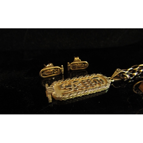 5057 - A gold belcher chain stamped 375, hung with a gold Egyptian pendant and a pair of similar earrings, ... 