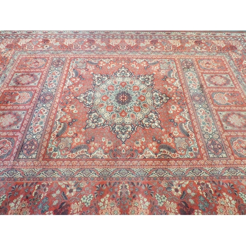 A 'Super Keshan' red ground wool rug made in Belgium multiple borders