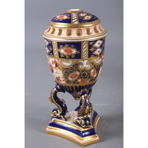 12 - A pair of Davenport Imari decorated pot-pourri vases and covers (one repaired with losses), on dolph... 