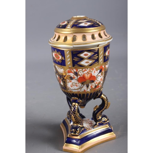 12 - A pair of Davenport Imari decorated pot-pourri vases and covers (one repaired with losses), on dolph... 