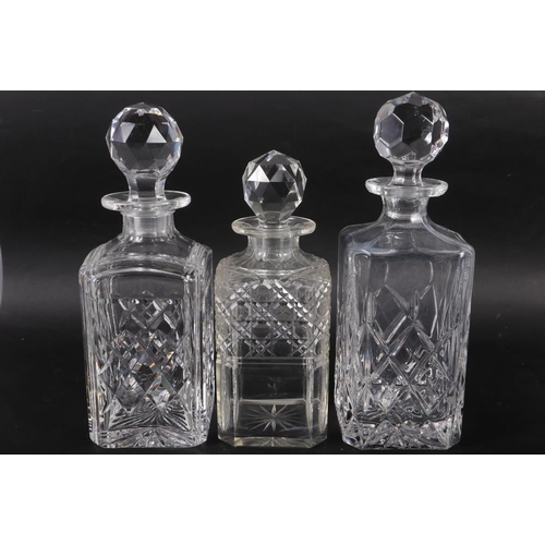 51 - An early 20th century whisky decanter (small chips to stopper),  two other whisky decanters (tallest... 