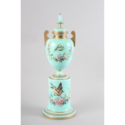 16 - A 19th century Continental green glass and enamelled two-handled vase and cover with bird and flower... 