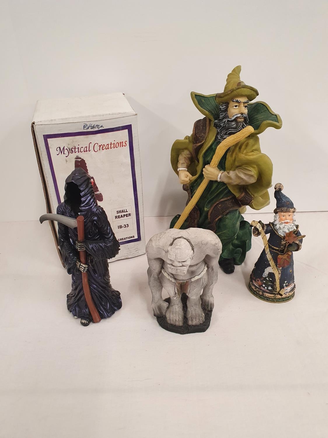 Group of resin fantasy figures, mainly wizards but also Detritus the ...