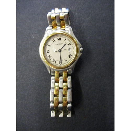 A vintage Cartier quartz watch with ancillary date dial, in good working  order