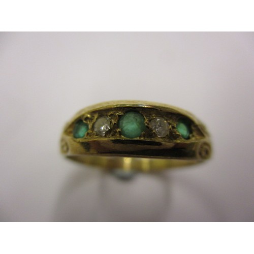 3 - A 9ct gold ring set with emeralds and diamonds. Approximate weight 1.9g, approximate ring size P