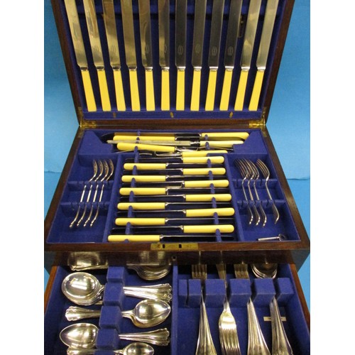 An early 20th century oak cased canteen of cutlery by J W Benson. A 12 place setting but missing 5 desert forks and spoons