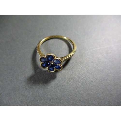 60 - An 18ct yellow gold sapphire and diamond flower style dress ring, approximate ring size P. Sapphire ... 