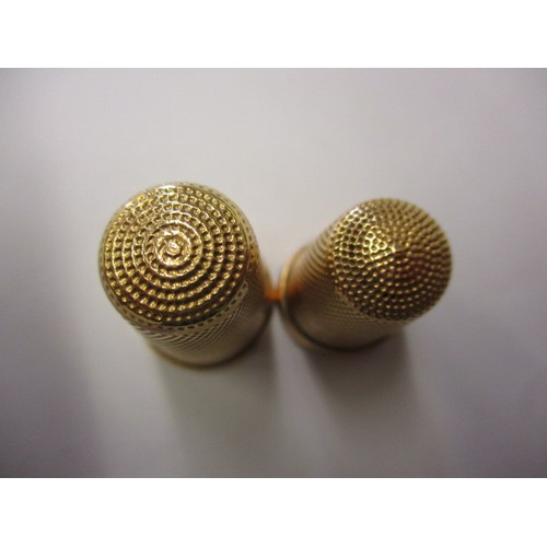 53 - Two continental yellow gold sewing thimbles, both in good condition, approx. weight 8.3g