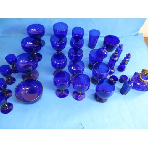 A parcel of antique and later Bristol Blue glass items, to include some that were sold through Liberty of London, a brass top inkwell and drinking glasses all in good pre-owned condition with no observed damage