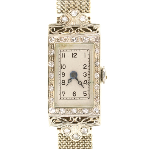 35 - AN ART DECO COCKTAIL WATCH in 18ct white gold, 22 X 14 mm, on 9ct white gold mail bracelet, Birmingh... 