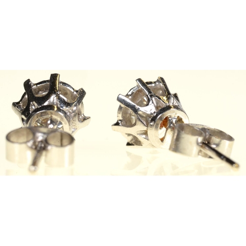 15 - A PAIR OF DIAMOND EAR STUDS  with round brilliant cut diamonds mounted in white gold, 6mm,  2g... 
