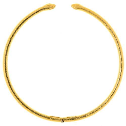 35 - ILIAS LALAOUNIS.  A GREEK GOLD SERPENT NECK RING hinged at the centre, approximately 132mm diam, mak... 