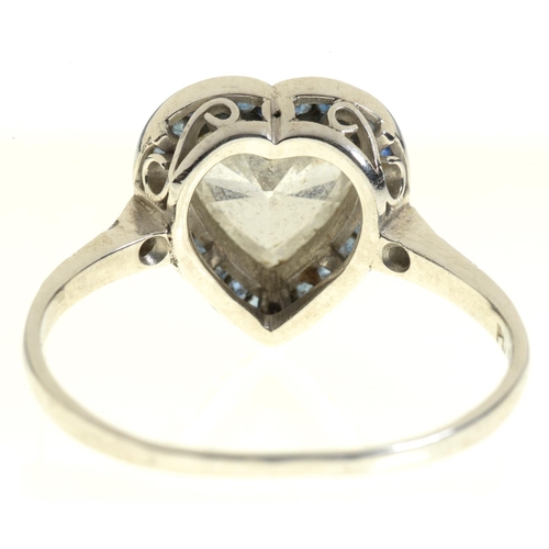 6 - A HEART SHAPED DIAMOND AND SAPPHIRE CLUSTER RING with surround of calibre cut sapphires and diamond ... 