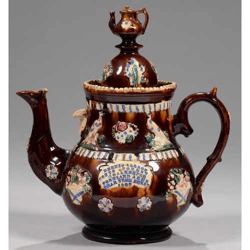 849 - FOOTBALL INTEREST.  A  BARGEWARE TEAPOT AND COVER, DATED 1902 sprigged with birds, baskets of flower... 