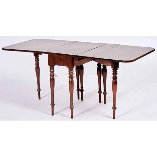 1436 - Nursery Furniture. An unusual early Victorian mahogany drop leaf dining table, c1850, on baluster le... 