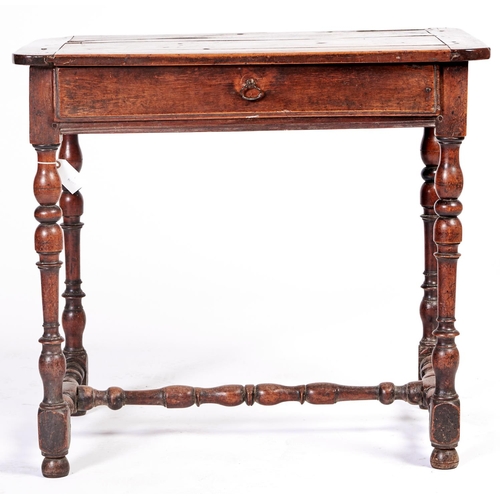 1443 - A French provincial walnut side table, early 18th c, the boarded top with cleated ends and front, fi... 