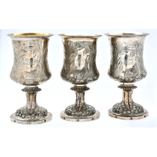 43 - The Henley Royal Regatta Silver Goblets. Three Elizabeth II rowing prizes, chased with lilies and ru... 