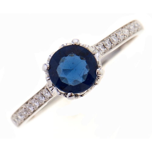 33 - A sapphire and diamond ring, in white gold, marked K18, 1.9g, size N