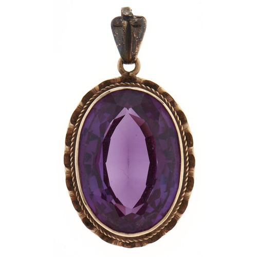 55 - A synthetic colour change sapphire pendant, in gold, 4.3g,