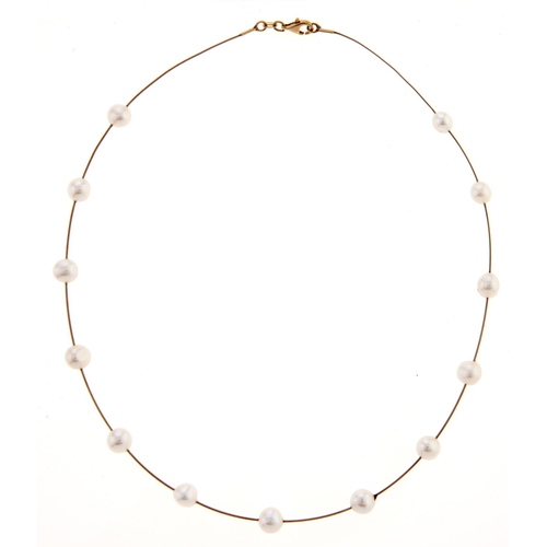 57 - A 14ct gold necklet with cultured pearls at intervals, 8.8g