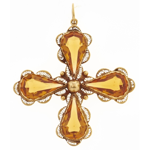 58 - A citrine cruciform pendant, with four pear shaped drops in gold filigree, marked C18, 10.4g