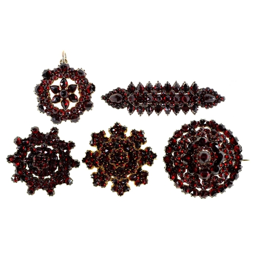 107 - Four garnet brooches and a pendant, late 19th c, oblong brooch 54mm l, 32.6g