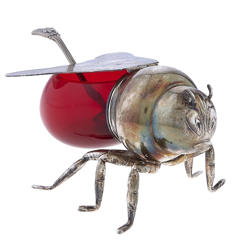 554 - An EPNS mounted red glass bee novelty honey pot and a plated spoon