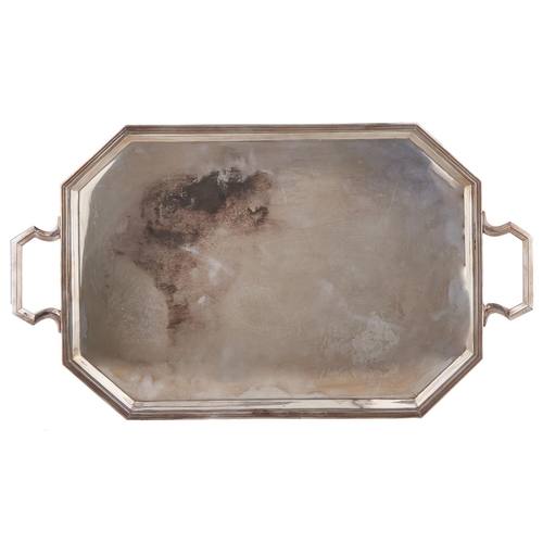 735 - A George V silver tea tray, cut cornered with moulded border, 66cm over handles, by Hawksworth, Eyre... 