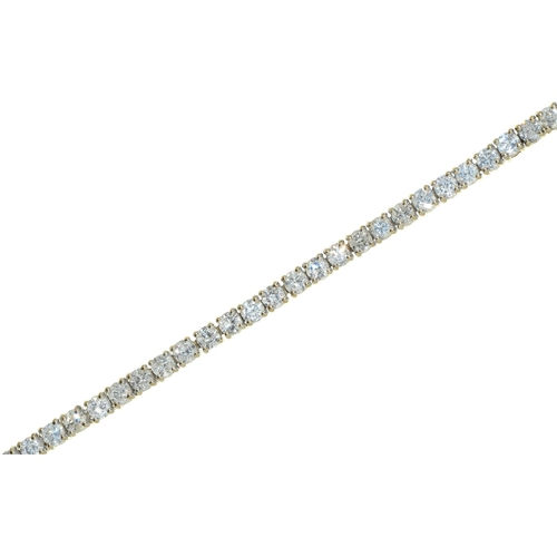 78 - A diamond line bracelet, of round brilliant cut diamonds weighing in total approximately 4ct, in 9ct... 