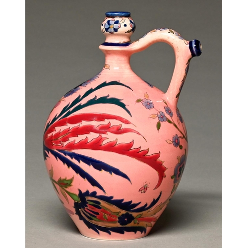 918 - A Zsolnay ewer, c1880, decorated in the Magyar-Turkish style with a long tailed bird, tulips an... 