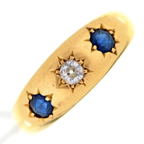 1 - A sapphire and diamond ring, gypsy set in gold marked 18ct, 5.3g, size R