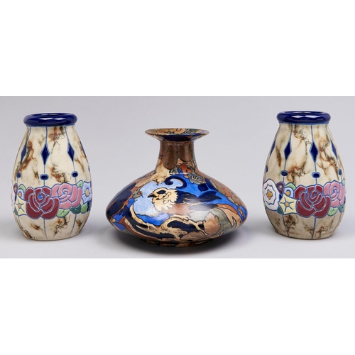 500 - A pair of Continental pottery vases, decorated in art deco style, the marbled bodies with band of st... 