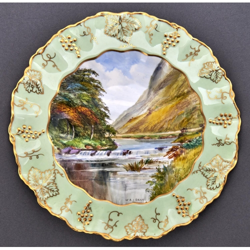 516 - A Royal Crown Derby vine bordered plate, c1940, painted by W E J Dean, signed, with a view in Doveda... 