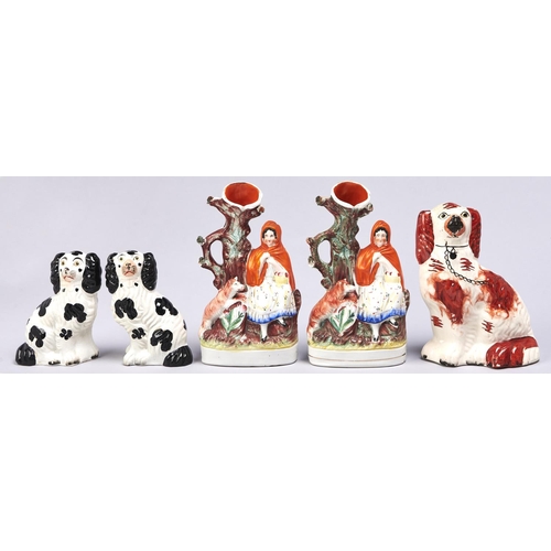526 - Two Staffordshire Little Red Riding Hood flatbacks, 19th c, 25cm h, a pair of Staffordshire black an... 