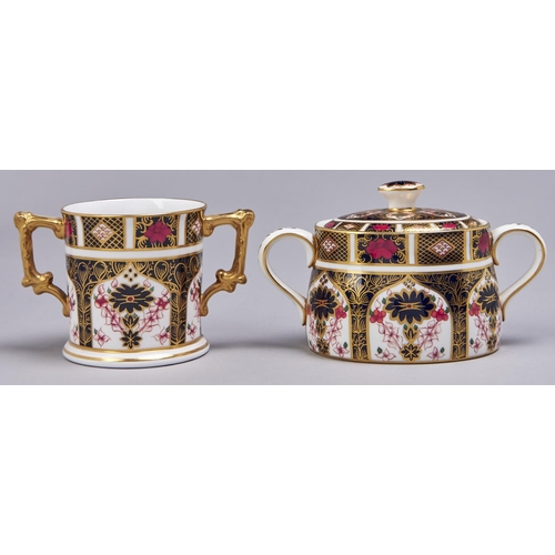 527 - A Royal Crown Derby oval Imari sugar bowl and cover and loving cup, 1973 and 1974, 80 and 75mm h, pr... 