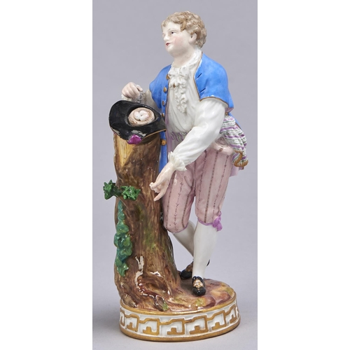 540 - A Meissen figure of a youth with a bird's nest, late 19th c, on round gilt base, 18.5cm h, incised F... 
