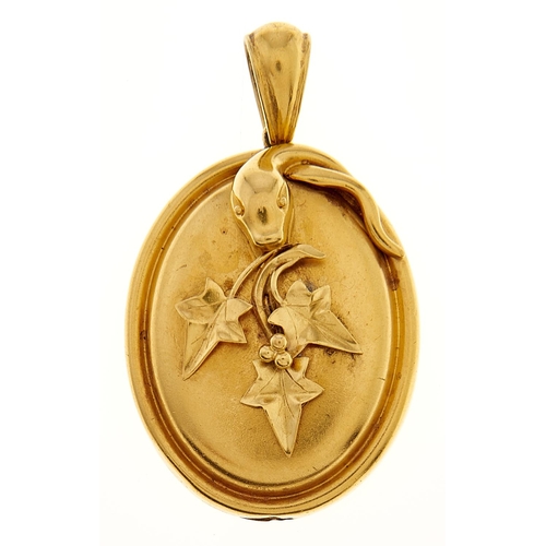 55 - A Victorian gold locket, applied with serpent and ivy leaves, 46mm, 11.3g