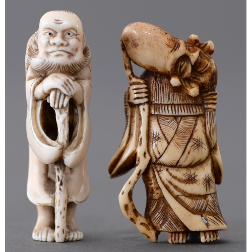 1079 - A Japanese ivory netsuke of Jurojin, 19th c, with elongated, tilted head and carrying a staff and an... 