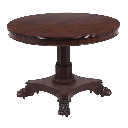 12 - A William IV mahogany breakfast table, the figured round tip up top on stepped octagonal pillar, pla... 