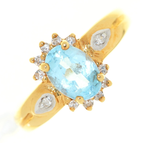 508 - An aquamarine and diamond cluster ring, in 18ct gold, import marked London 1994, 3.6g, size I... 