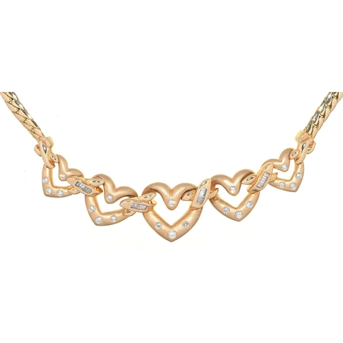 545 - A diamond linked hearts necklace, in gold, 50cm l, marked 14k, 39g