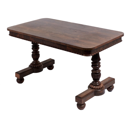 6 - A George IV rosewood pillar-end library table, attributed to Gillows, the finely figured oblong top ... 