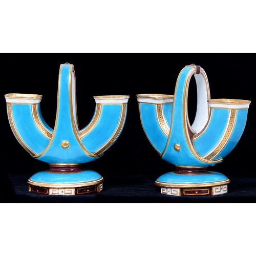 122 - A pair of Minton 'U' shaped basket form vases,  c1870,  with turquoise ground and brown and gilt bor... 