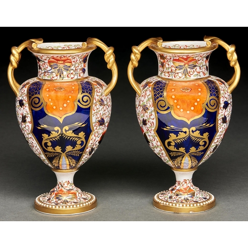 27 - A pair of Davenport Japan pattern bone china two handled vases, late 19th c, of shield shape with kn... 