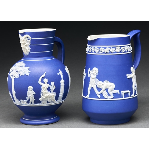 36 - A Wedgwood dark blue jasper dip Doric jug and another, 1882 and 1890, sprigged with classical figure... 