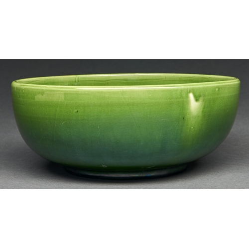 45 - Liberty & Co. A C H Brannam green glazed Barum ware fruit bowl, c1920,  26cm diam, circular impr... 