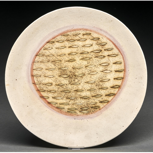 47 - Studio pottery. Laurel Keeley (1952-) Dish,  grogged creamy buff stoneware incised with a shoal of f... 